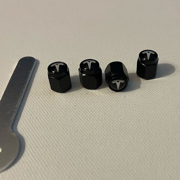 Tesla valve Stem caps in Black set of 4 NWT - Picture 2 of 4